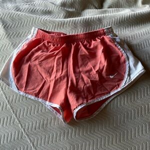 Coral kids Nike shorts.